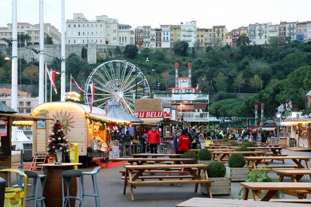 Monte-Carlo, Monaco - December 13, 2018:  People Walking In The Christmas Village. Monaco Christmas Market 2018 In The French Riviera, Europeのeditorial素材
