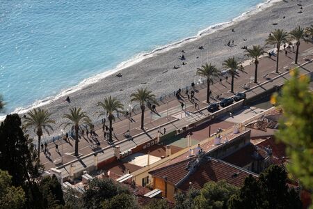 Nice, France - February 6, 2019: Beautiful Aerial View Of The Promenade Des Anglais With Palm Trees, Tourists, Road Traffic, The Beach And The Mediterranean Sea In Nice, France, Europeのeditorial素材