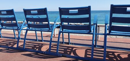 Blue Chairs Along The Promenade Des Anglais In Nice, Symbol Of Nice, Mediterranean Sea, French Riviera, France, Europeの写真素材