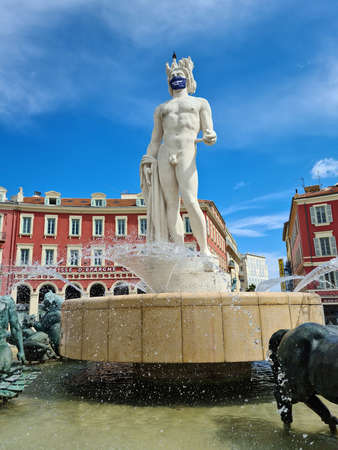 Nice, France - June 9, 2020: Fountain Of The Sun (Fontaine Du Soleil), Statue Of Apollo With Surgical Mask During Covid-19 Time On Place Massena In Nice, French Riviera, France, Europeのeditorial素材