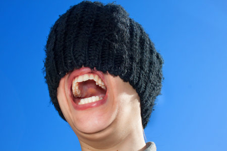 Girl with Hat on Face Screaming