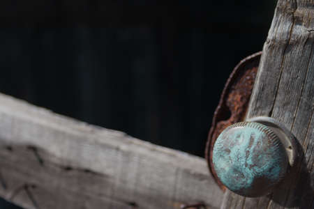 Broken door knob on abandoned shedの写真素材