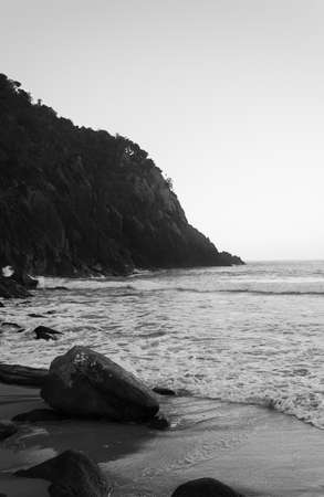 rock on beach at duskの写真素材