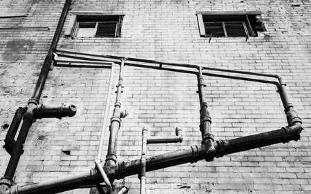External plumbing in an alleyway.の写真素材