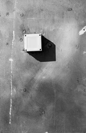 Plastic electrical casing on metal plateの写真素材