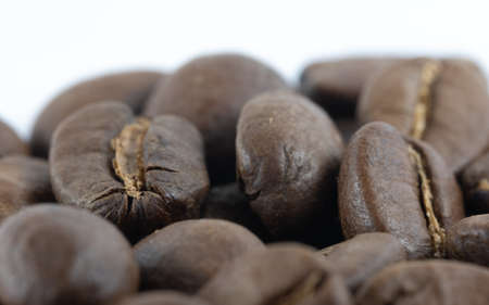 Closeup of a pile of coffee beans with white space at the topの写真素材