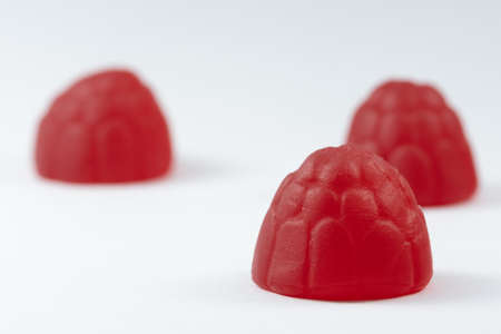 Trio of raspberries on a white backgroundの写真素材