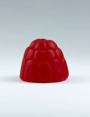 Raspberry candy closeup, centred with white backgroundの写真素材