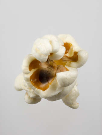 Macro image of popcorn on grey backgroundの写真素材