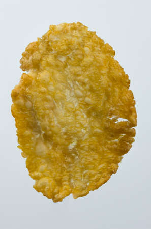 Macro image of flaked corn isolated against white backgroundの写真素材