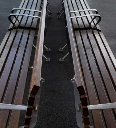 Empty benches at a public transport terminalの写真素材