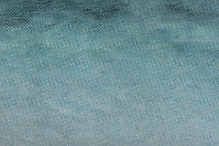 Macro image of a blue gradient CMYK dots on newsprint