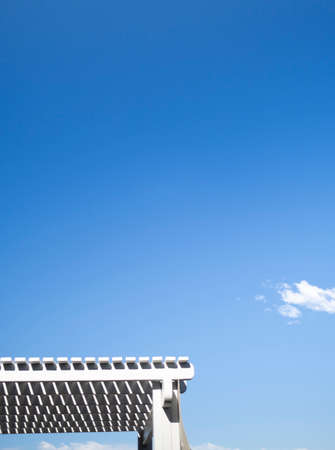 Timber roofline of a cabana against a clear blue skyの写真素材