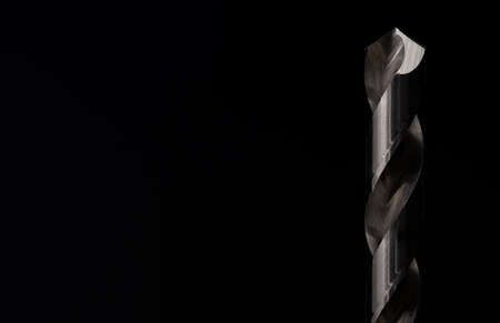 Macro image of a drill bit set against a black backgroundの写真素材