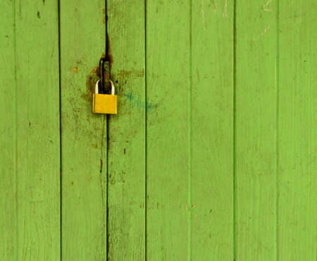 Old wood door with padlockの写真素材