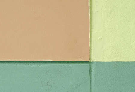 green and beige paint on a wallの写真素材