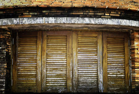 Old vintage window with wooden latticeの写真素材