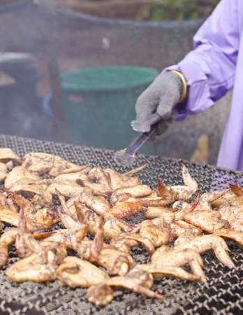 Grilled chickens are cooked in the restaurantの写真素材