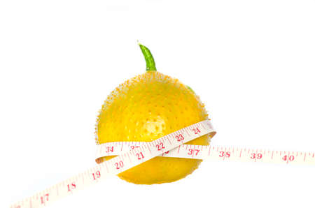 Gac fruit with measurement isolated on whiteの写真素材