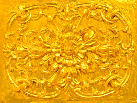 Golden Thai decorative pattern on temple wallの写真素材