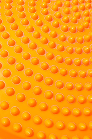 Abstract dotted orange plastic backgroundの写真素材