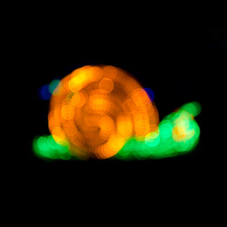 Abstract snail shape de-focused lights bokehの写真素材