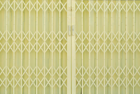 Yellow metal grille sliding door