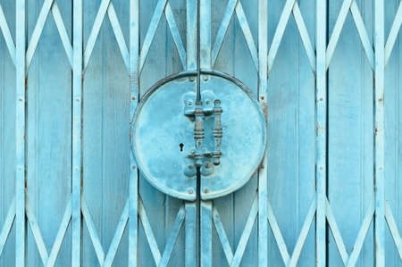 Light blue old metal grille sliding doorの写真素材