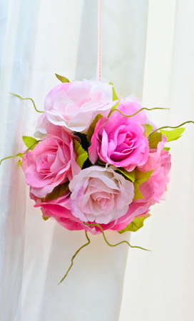 Bouquet ball decoration with white satin backgroundの写真素材
