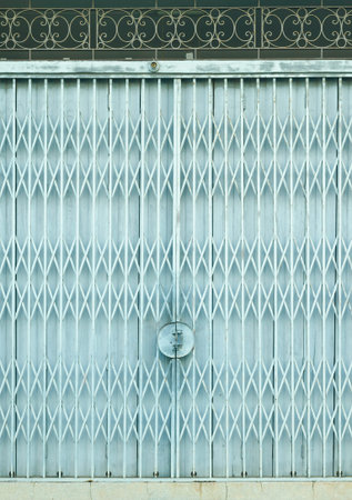 Light blue old metal grille sliding door