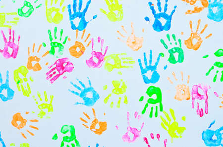 colorful hand prints on a wallの写真素材