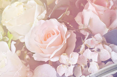 Soft focus artificial orange and white rose  flowers bouquetの写真素材