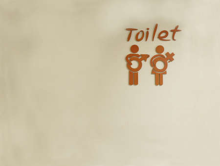 Male and female toilet sign on wallの写真素材