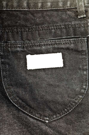 Close up of  black jean pocket with blank white labelの写真素材