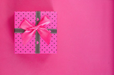 Gift boxe on pink background with copy space, concept for Valentine's Day, Mother's Day, Christmas, birthday and anniversaryの写真素材