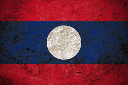 Lao People's Democratic Republic flag on grunge stone backgroundの写真素材
