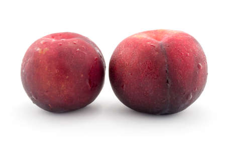 Red peach, isolated on white backgroundの写真素材