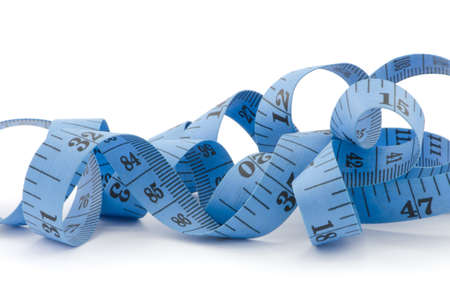 Close up of blue measuring tape for health concept, isolated on white backgroundの写真素材