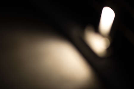 Abstract city street light defocused at night, blur bokeh, colorful & dark background.の写真素材
