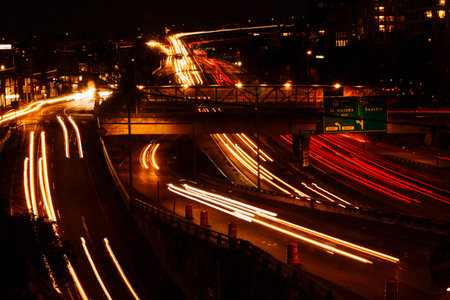 Streaks of Headlights and Tail Lights on Freeway at Night