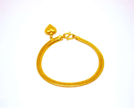 Gold bracelet on white backgroundの写真素材