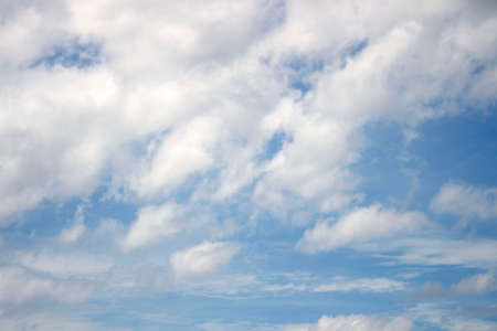 Blue sky with clouds backgroundの写真素材