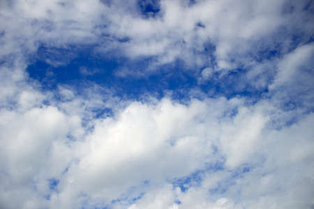 Blue sky background with clouds. Natural background.の写真素材