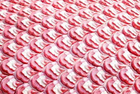 Art seamless patterns of pink serpent scale skin in temple backgroundの写真素材