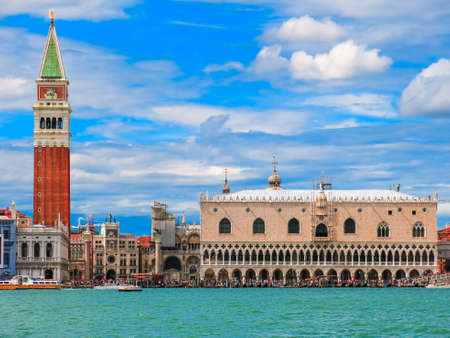 San Marco Tower with Piazza San Marco taken from a water taxi and blue skies.のeditorial素材