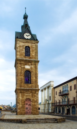 In the old city of Jaffa in Israel is an old building with a clock tower in downtownの写真素材