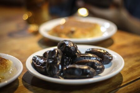 Dates and knafeh served as a traditional arabic desert dishの写真素材
