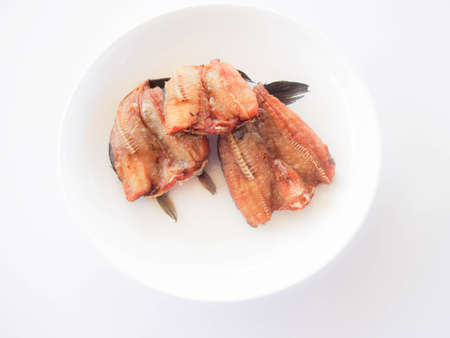 Crispy fish in a white and golden plateの写真素材