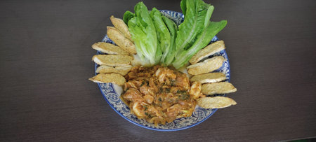 Larb Kung and Tempeh, crispy, eaten with green cos vegetables: a spicy Thai food mixed with Indonesian food. popular fermented beans It's called tempeh as a source of protein. bring to cookの写真素材