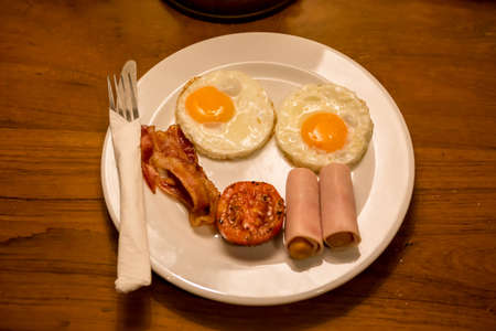 Bacon Breakfast as the following baked tomatoの写真素材